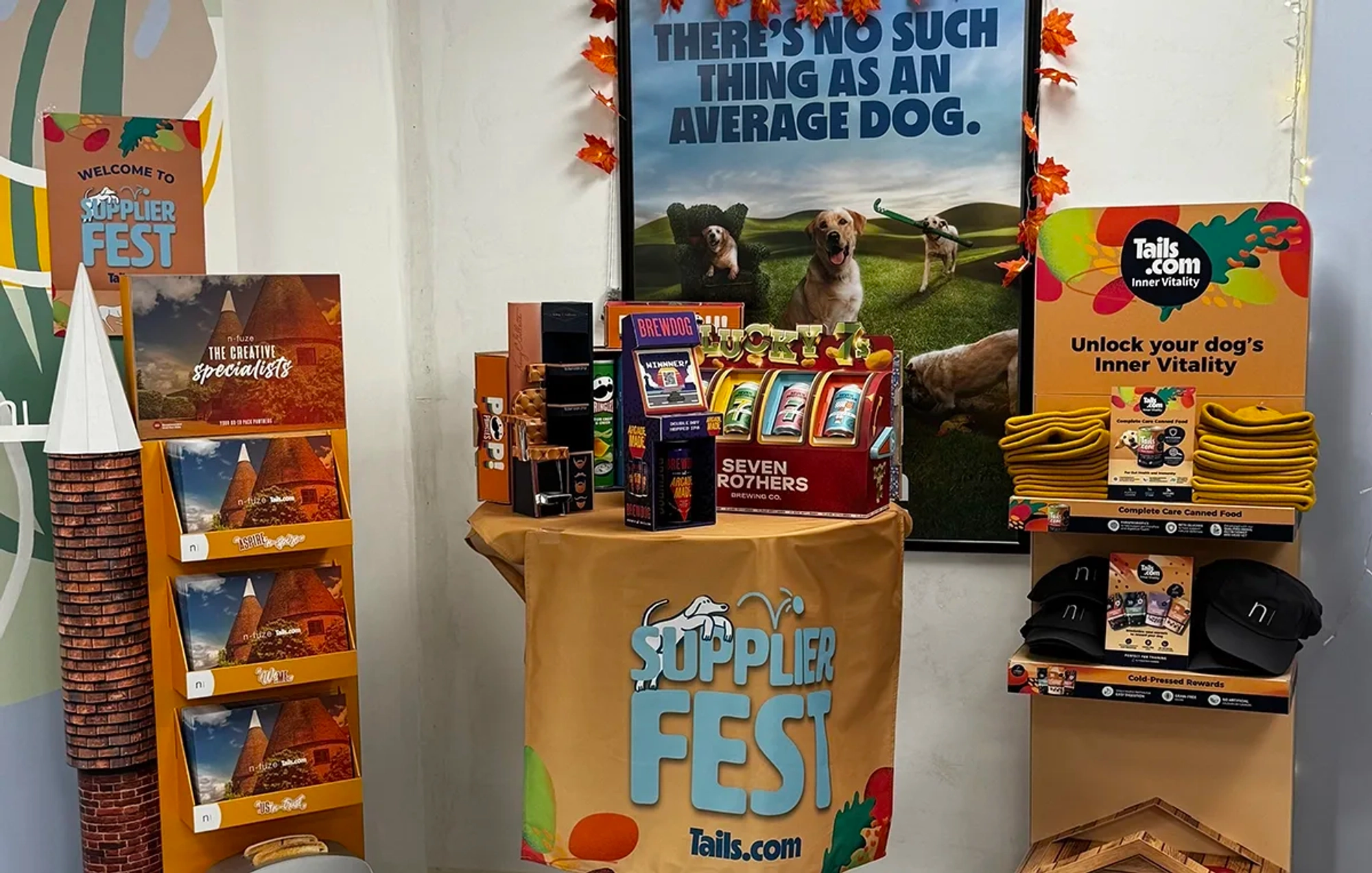 A display of Tails.com and other branded point of sale and merchandise items ready for presentation