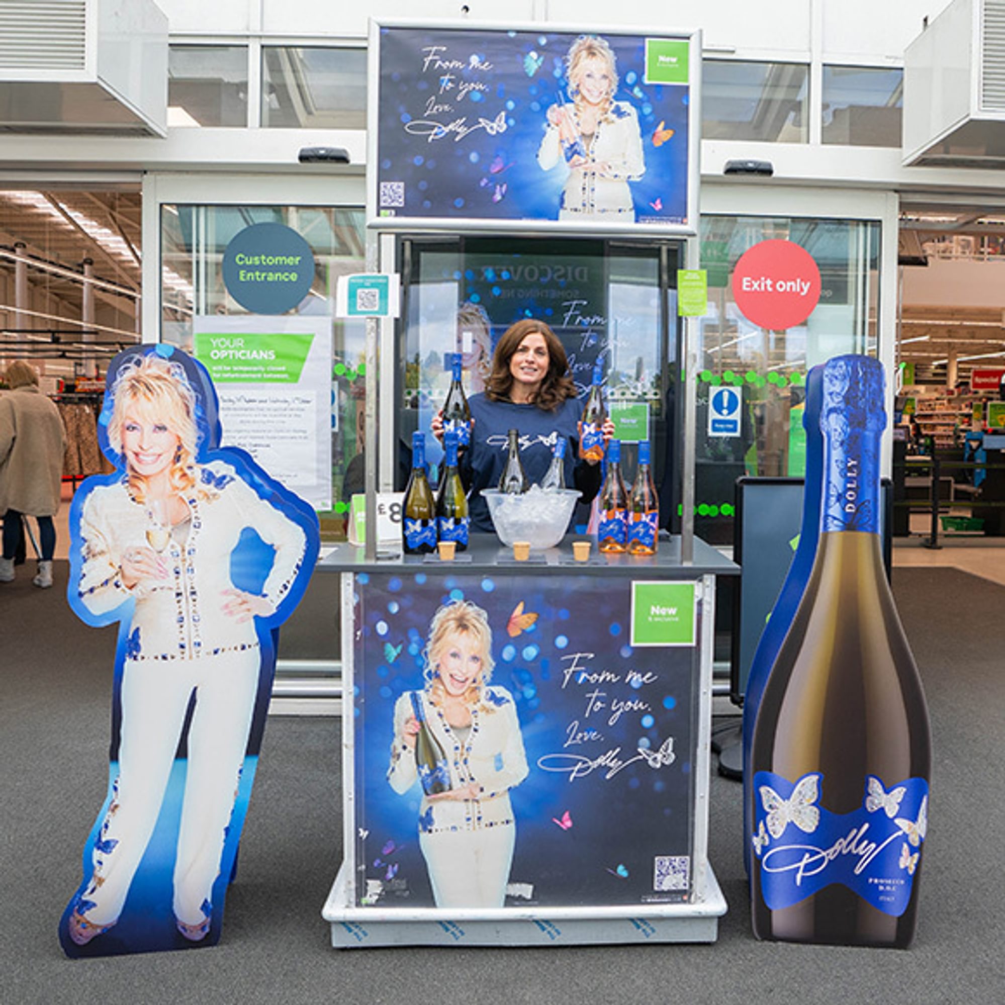 A selection of POS items around a front of store tasting stand at a large supermarket
