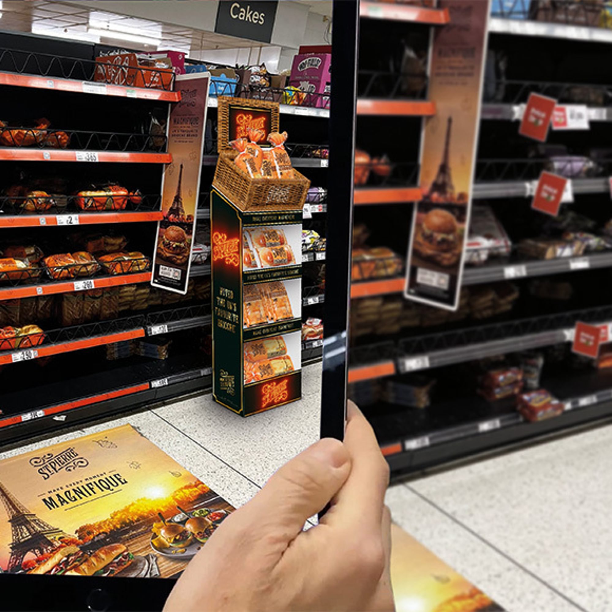 An iPad held up in-store displaying an AR overlay of shelving with a 3D model of a floor standing display unit