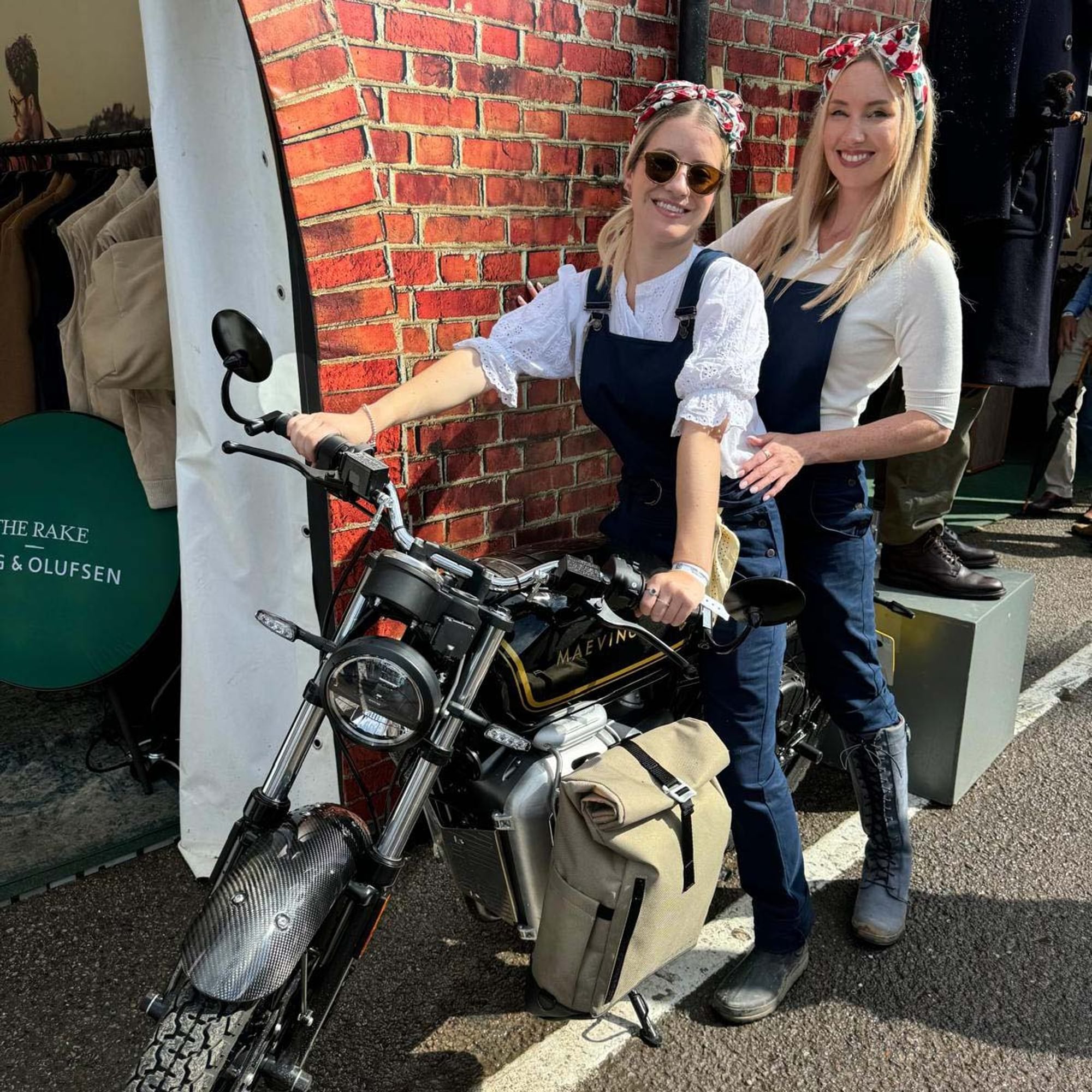 Private White V.C. team on a classic motorbike while dressed in 1940s mechanic overalls